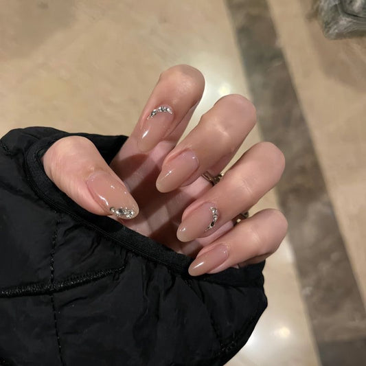 NailZagreb Glossy Nude Almond Press On Nails with Silver Rhinestone Details for Elegant Everyday Looks